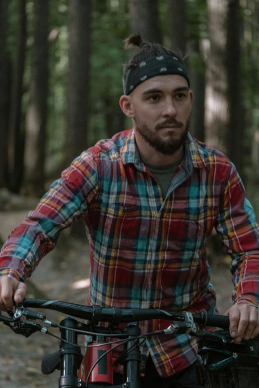 a man on a bike in the woods