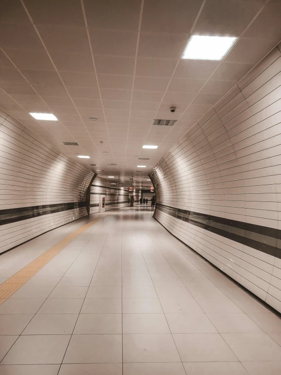 a long hallway with a light at the end of it, inspired by Thomas Struth, unsplash contest winner, futuristic cyber subway station, hyper realism 8k, profile image, staggered depth)