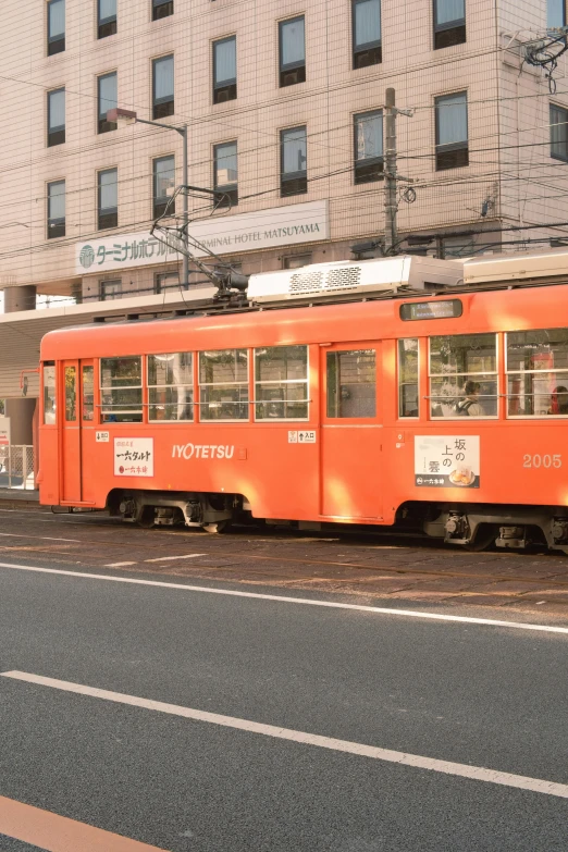 a trolley is sitting in front of a building