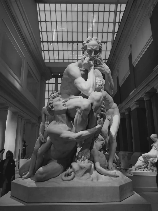 a black and white photo of a statue in a museum, neoclassicism, devouring, roberto ferri and ruan jia, atrium, casey baugh and james jean