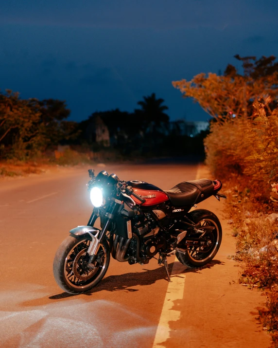 a motorcycle is parked on the side of the road, pexels contest winner, lighting 8k, portrait of jerma985, dual tone lighting, shot on sony a 7