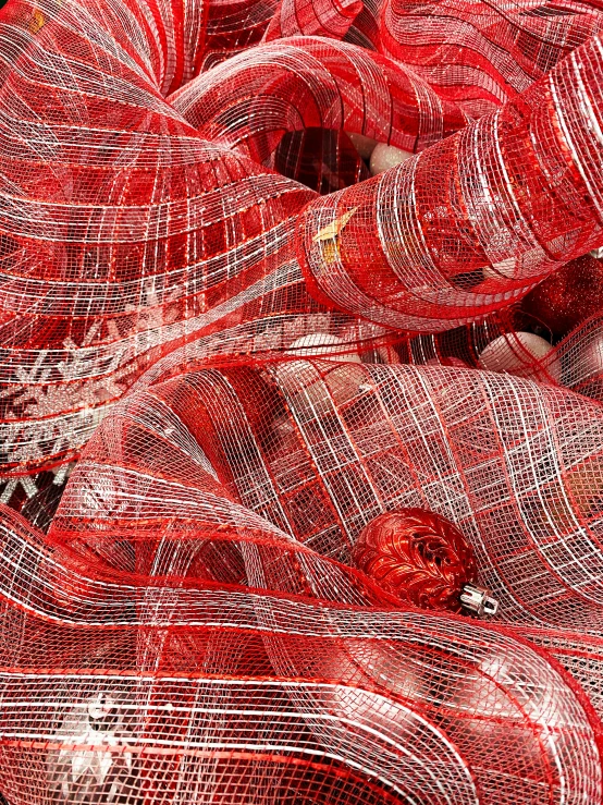 a pile of red and white christmas ornaments, inspired by Chiharu Shiota, shutterstock contest winner, process art, mesh fabrics, checkered motiffs, close-up product photo, andrey gordeev