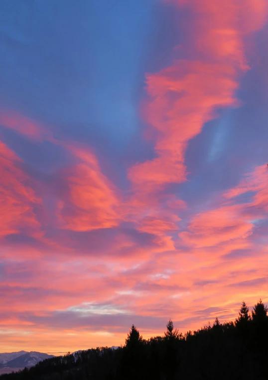 the sky is pink and blue as the sun sets, by Terese Nielsen, swirly clouds, taken in the late 2010s, red skies, # nofilter