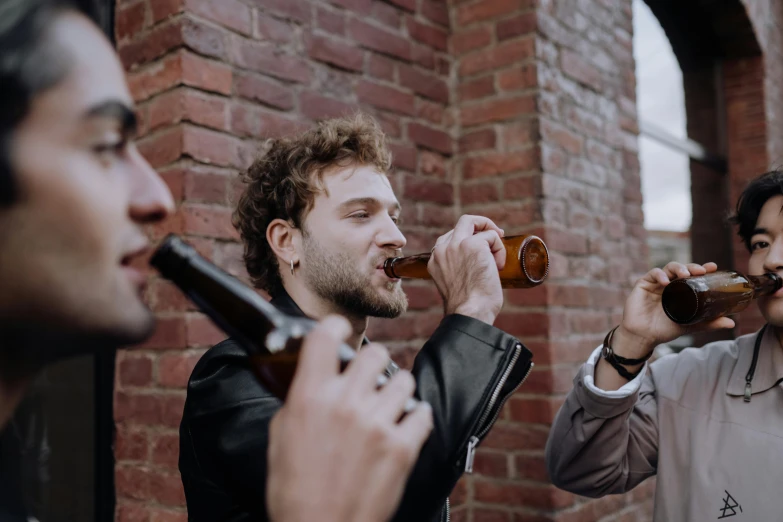 a group of men standing next to each other drinking beer, pexels contest winner, renaissance, profile image, chewing tobacco, background image, over-the-shoulder shot