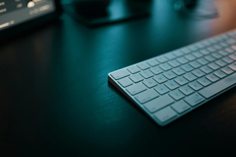 a computer keyboard sitting on top of a wooden desk, by Carey Morris, trending on pexels, nighttime, smooth.sharp focus, thumbnail, modeled