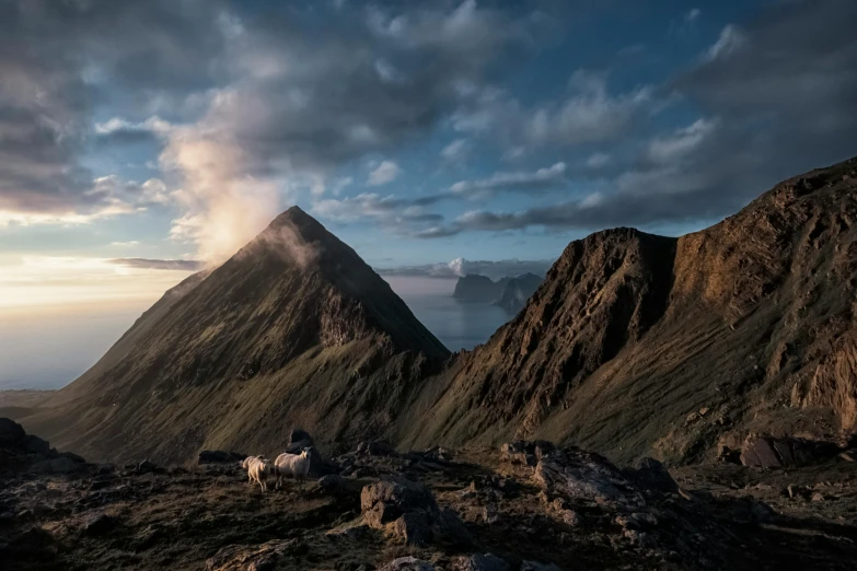 there are mountains and clouds with clouds all around