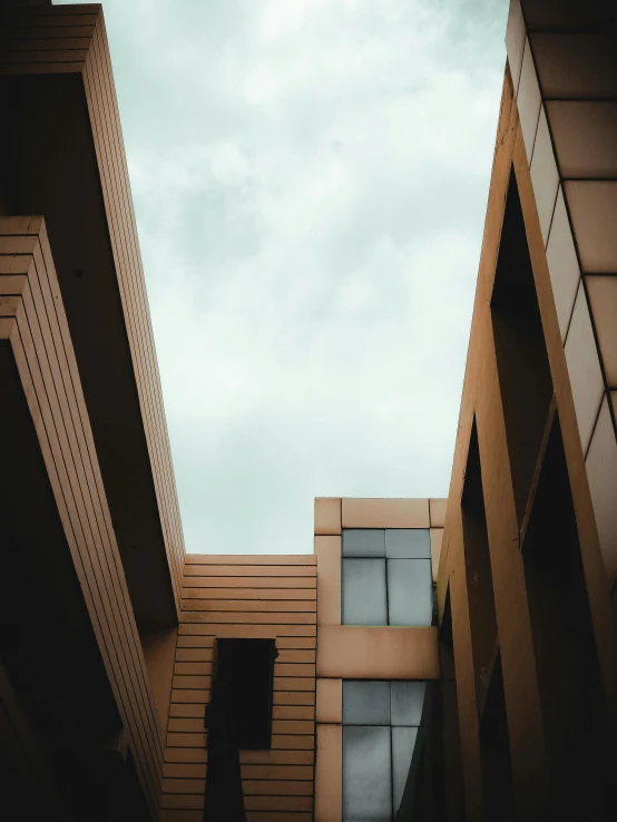 view of a side of an office building as viewed from the bottom of another building