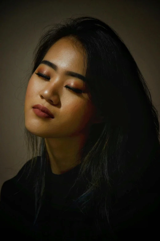 a close up of a woman with her eyes closed, a picture, inspired by Yang J, trending on pexels, realism, dark. studio lighting, 🤤 girl portrait, young cute wan asian face, pondering