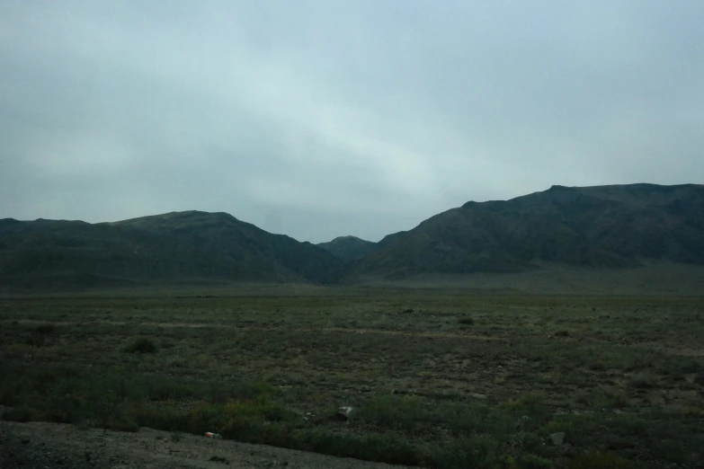 the mountain are green with sp vegetation and rocks