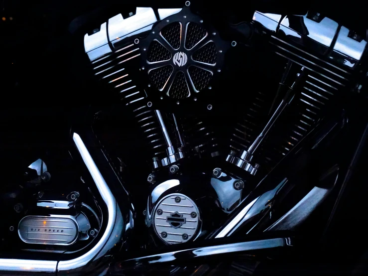 a close up of the engine of a motorcycle, by David Donaldson, pexels contest winner, photorealism, high contrast of light and dark, flat shaped chrome relief, high contrast colors, “hyper realistic