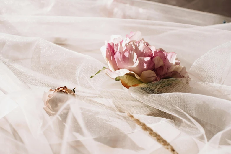 an open umbrella, some flowers and some string