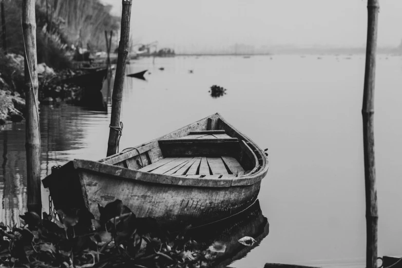 a black and white photo of a boat in the water, by Adam Szentpétery, pexels contest winner, wooden, photo of poor condition, mobile wallpaper, illustration!