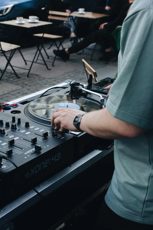 a man that is standing in front of a mixer, an album cover, pexels, rooftop party, audio equipments, thumbnail, multiple stories