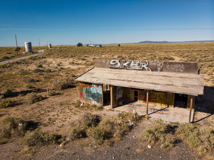 an old abandoned shack is sitting in the middle of the nowhere