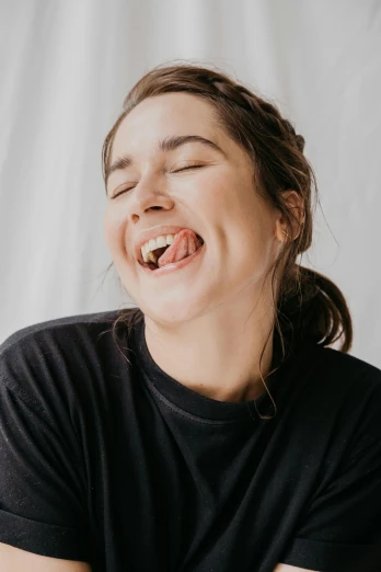 a woman is laughing with her eyes closed, by Grace Polit, happening, licking tongue, highly upvoted, pokimane, sydney hanson