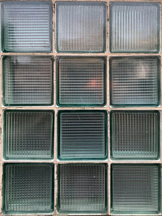 an image of many glass blocks that are on the wall