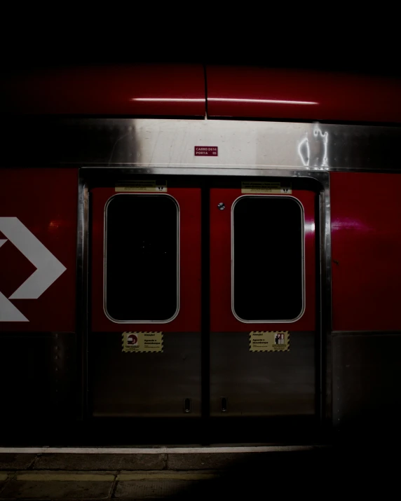 a close up of two doors on a train, by Kristian Zahrtmann, pexels contest winner, dark red, the city of toronto, square, lgbtq