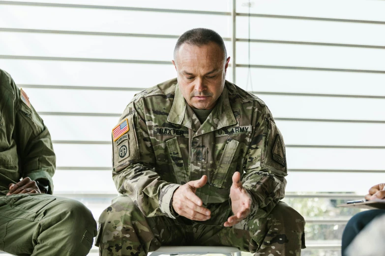 a group of military men sitting next to each other, multicam uniform, avatar image, teaching, michael pangrazio