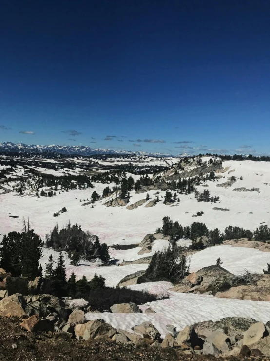 a snowy landscape with a clear blue sky