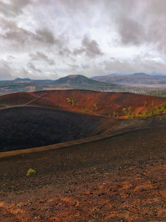 the view looking down on a hill from the top of a mountain