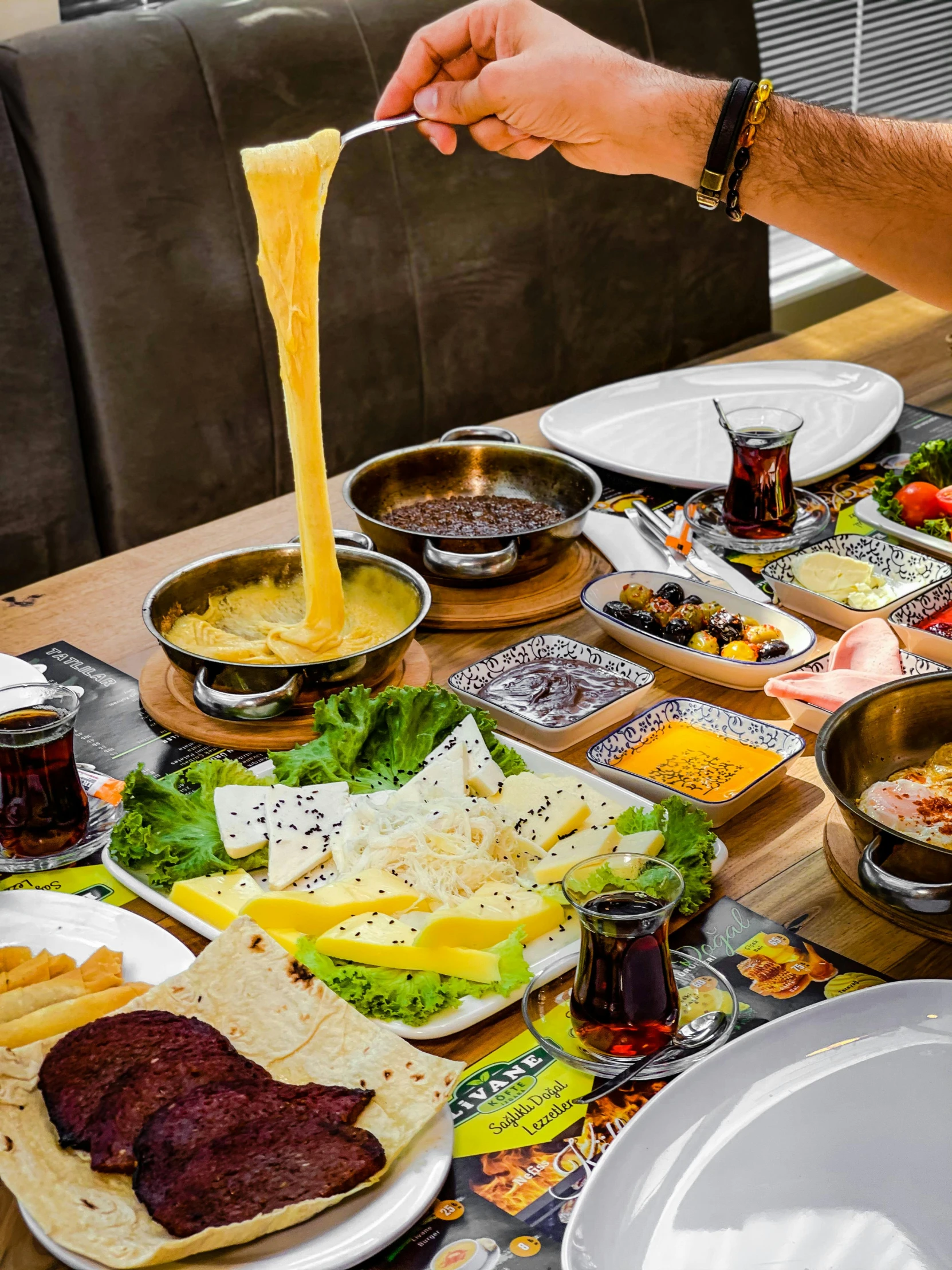 a large table topped with assorted plates of food