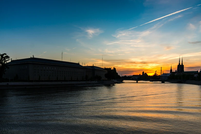 a body of water with a building in the background, by karlkka, pexels contest winner, sunset panorama, national archives, royal palace, today\'s featured photograph 4k