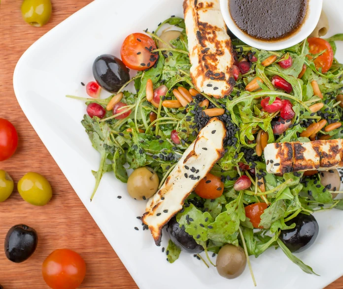 a close up of a plate of food on a table, square, rocket, 3 4 5 3 1, mediterranean