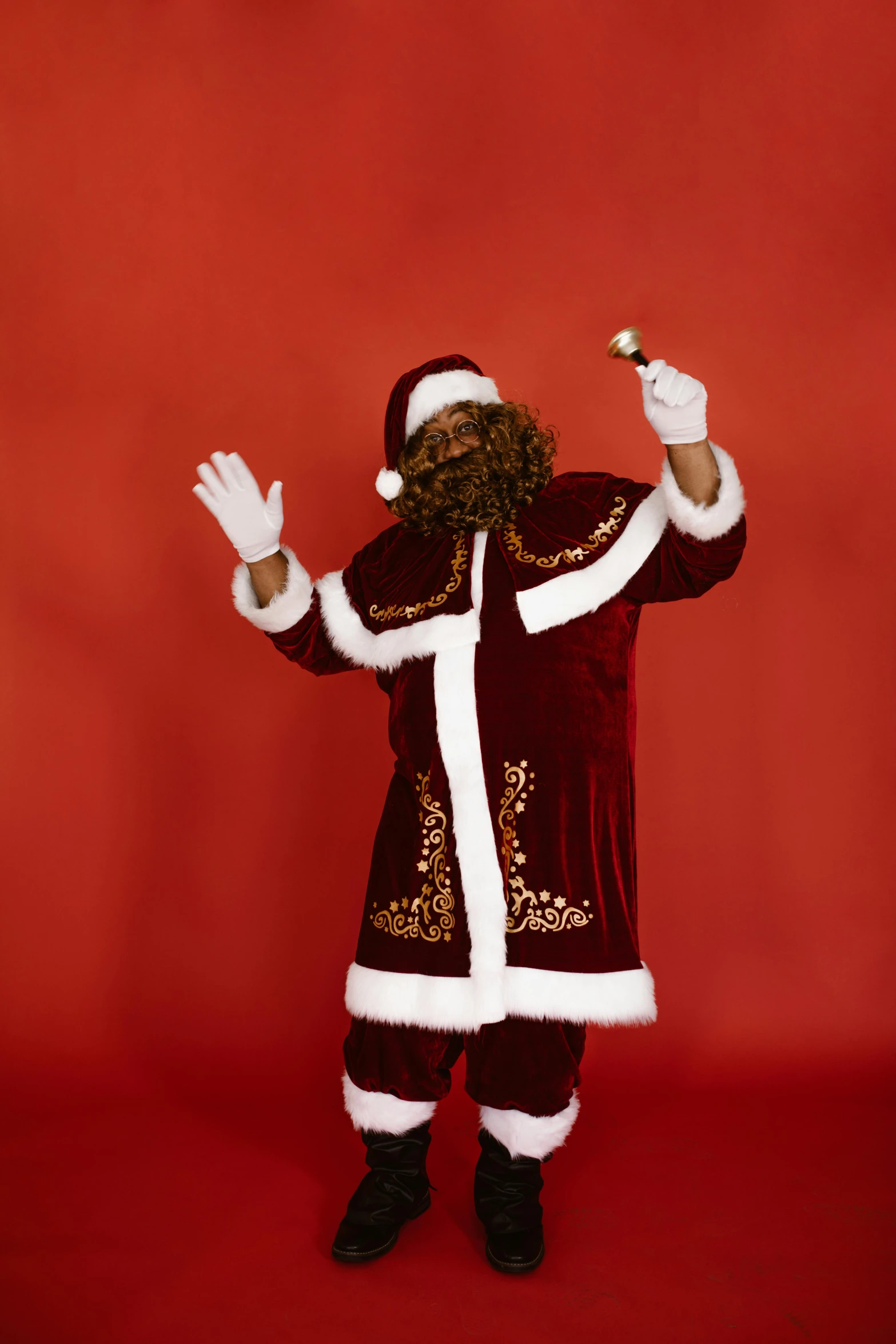 a santa claus man in red and white holding a cigarette