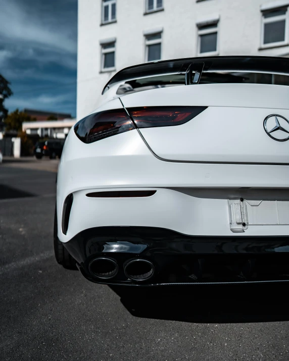 the front end of a white sports car