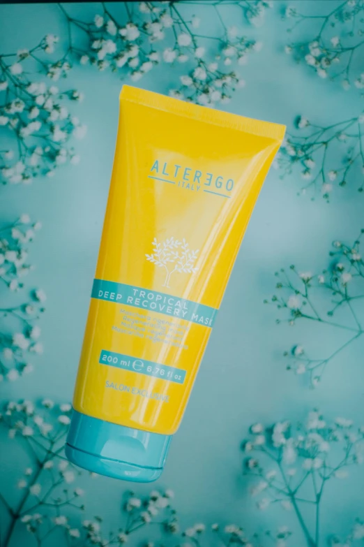 a tube of sunscreen cream on a blue background, inspired by Altichiero, yellow flowers, embrace the superego, alena, hair gel combed backwards