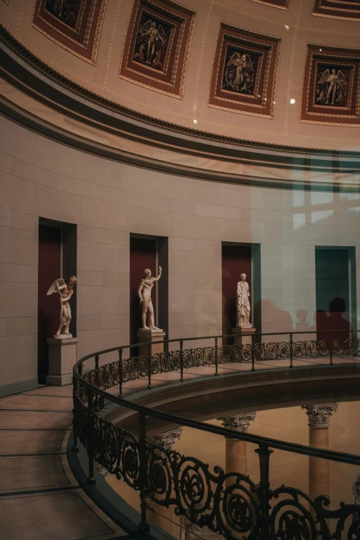 some statues that are in a museum together