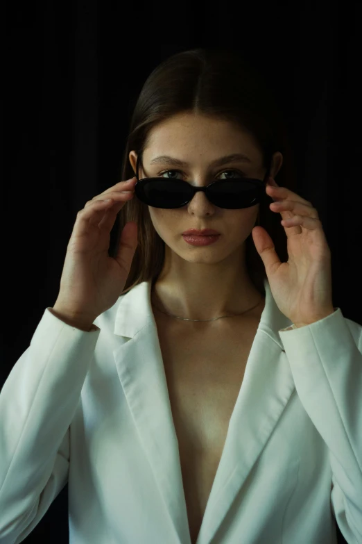 a woman in a white suit and sunglasses, inspired by Elsa Bleda, trending on pexels, renaissance, portrait sophie mudd, decollete, woman in black robes, androgynous male