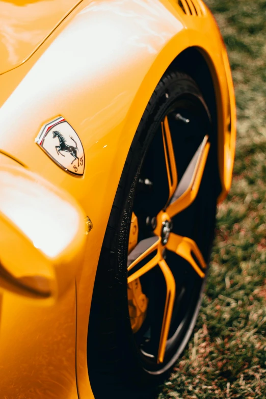 a close up of the side wheel of a sports car