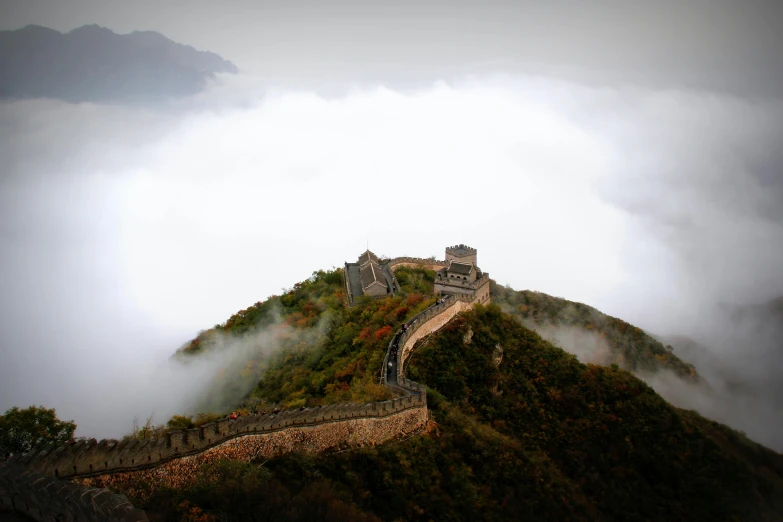 an ancient structure is on top of the mountain