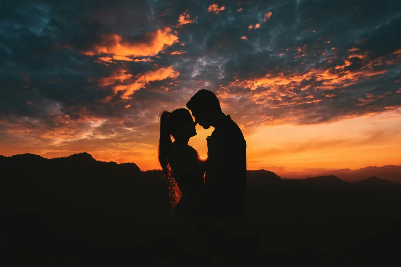 a couple kissing in front of a sunset, pexels contest winner, magnificent background, profile image, multiple stories, frank moth