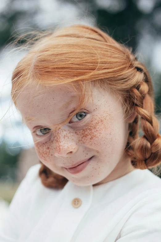 a close up of a child with freckles on her face, an album cover, pexels contest winner, renaissance, ( redhead, fair olive skin, scientific photo, white cheeks