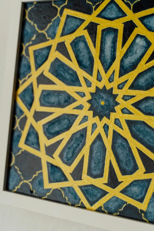 a close up of a painting on a wall, a detailed painting, inspired by Alberto Morrocco, trending on unsplash, geometric abstract art, islamic calligraphy, blue and yellow spiderman, carved from sapphire stone, framed art