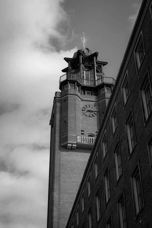 black and white pograph of a building tower in the city