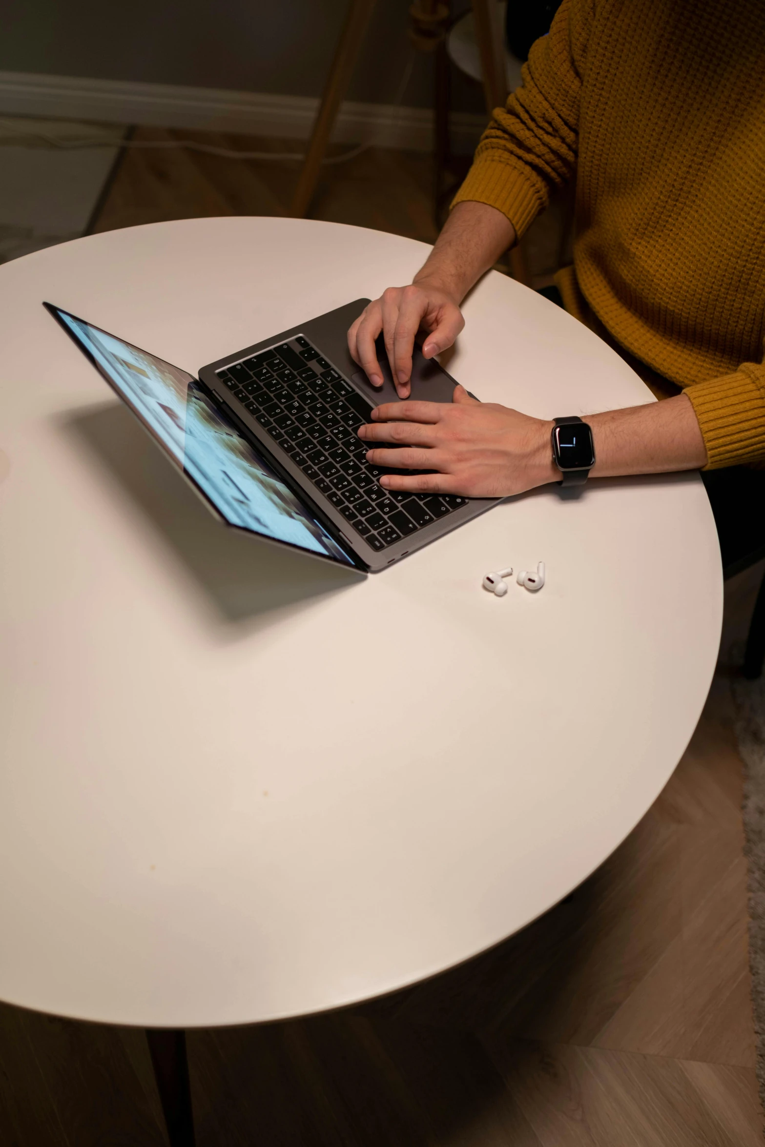 a person sitting at a table with a laptop, a computer rendering, unsplash, hyperrealism, mid air shot, extremely polished, tactile buttons and lights, professionally assembled