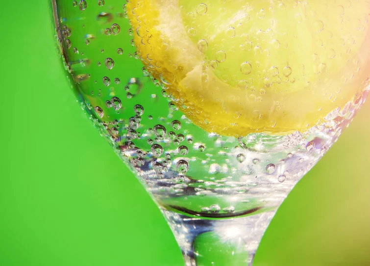 a glass of water with a slice of lemon in it, pexels, renaissance, green sparkles, bubbles, promo image, hyper-detailed