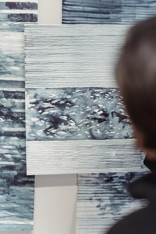 a man that is standing in front of a painting, a detailed painting, inspired by Richter, trending on unsplash, analytical art, cyanotype, close-up shot from behind, grey, gazing at the water