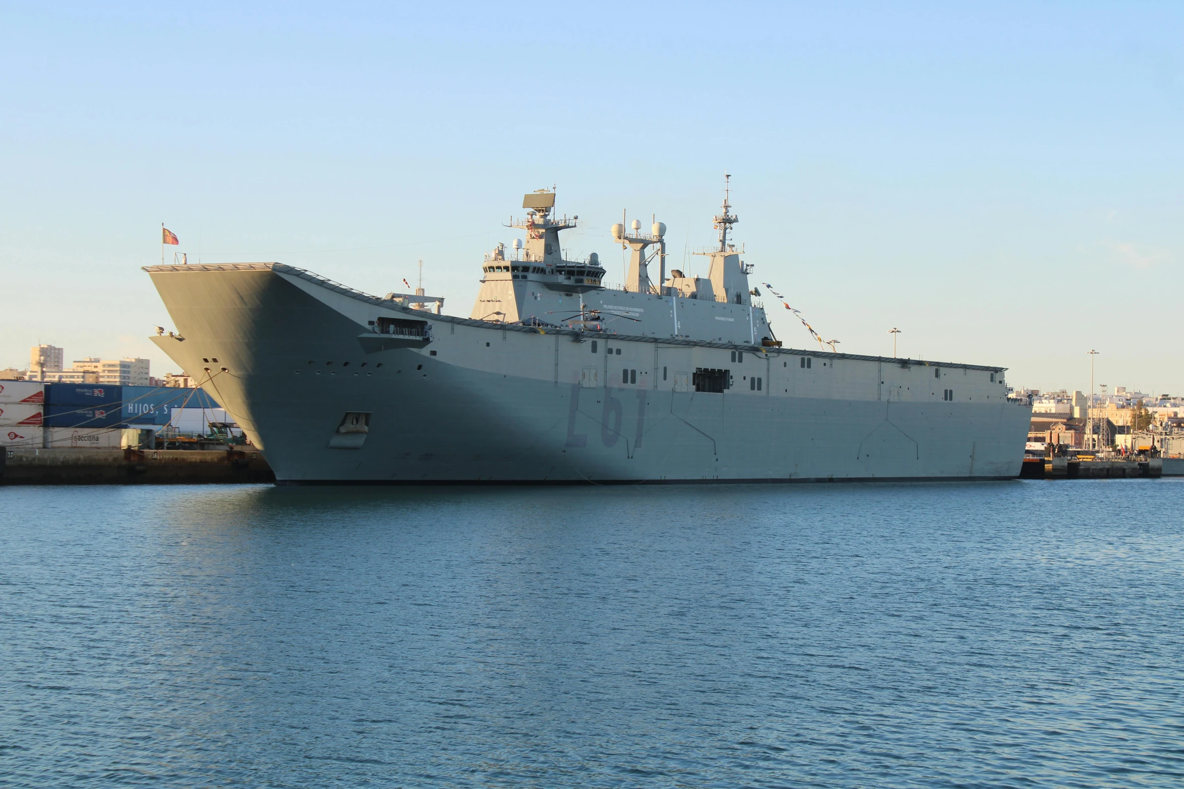 a large ship sitting on top of a body of water, a portrait, defence, no cropping, olive, frontal picture