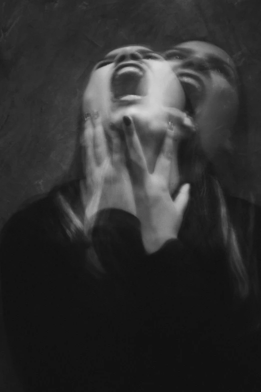 a woman covering her face with her hands, a black and white photo, by Kati Horna, tumblr, surrealism, transparent ghost screaming, blurry face, ✨🕌🌙, someone is screaming
