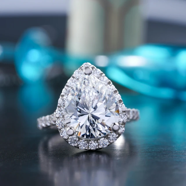 a diamond ring sitting on top of a table, tear drop, fan favorite, medium angle, decoration