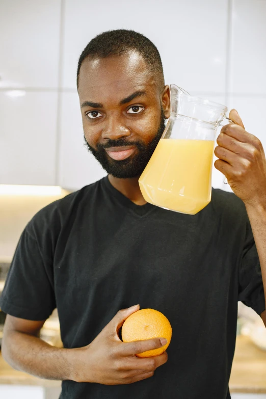 a man holding a glass of orange juice, featured on reddit, renaissance, man is with black skin, headshot profile picture, cooking show, leon tukker