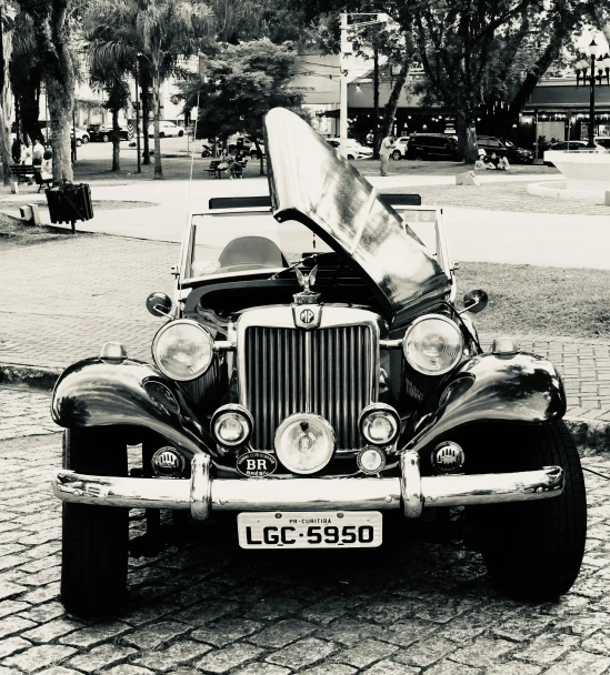 a black and white photo of a vintage car, by Sven Erixson, unsplash, são paulo, square, soft top, 🚿🗝📝