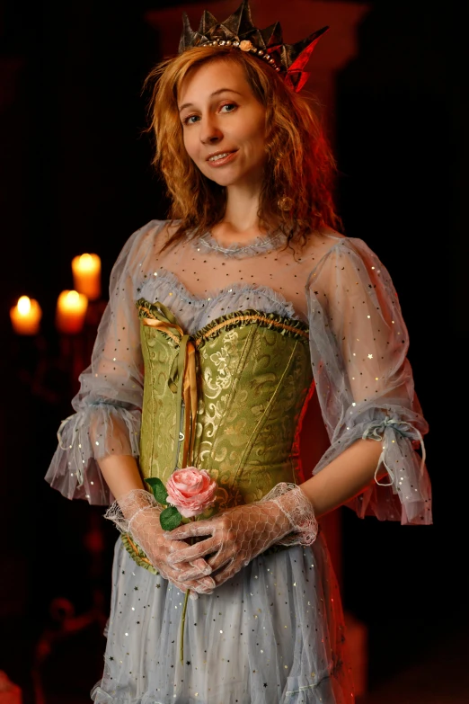 a woman in a dress with a rose in her hand, an album cover, inspired by Jean-Antoine Watteau, renaissance, shot with sony alpha 1 camera, corset, candlelit, concert photo