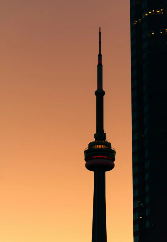 a tall tower sitting in the middle of a city, by Doug Ohlson, pexels contest winner, symbolism, 4 0 0 mm f 1. 2, toronto, empire silhouette, morning detail