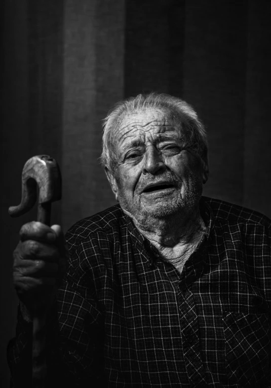 an old man with a hammer in his hand, a black and white photo, by Jozef Czapski, pexels contest winner, photorealism, with a hurt expression, holding a wrench, feels good man, portrait of a small