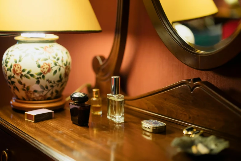 there is a mirror next to a wooden cabinet